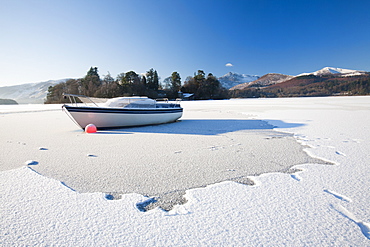 A boat locked in the ice on Derwent Water at Keswick in the Lake District during December 2010, Cumbria, England, United Kingdom, Europe