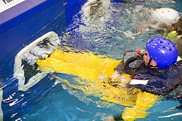 Workers in the offshore industry practise helicopter ditching evacuation as part of an industry training course, Billingham, Teesside, England, United Kingdom, Europe