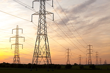 Power lines and pylons at sunset in Billingham, Teesside, England, United Kingdom, Europe