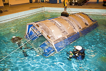 Workers in the offshore industry practise helicopter ditching evacuation as part of an industry training course, Billingham, Teesside, England, United Kingdom, Europe