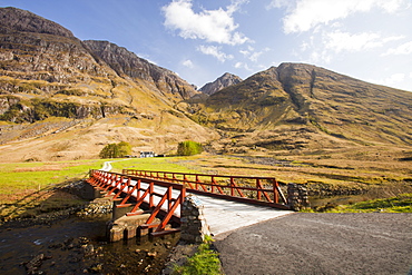 A bridge crossing the River Coe in Glen Coe, looking up to the summit of Bidean nam Bian, the highest peak in Argyll, Scotland, United Kingdom, Europe