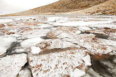 Avalanche debris and ice breaking up on Coire an Lochain, Cairngorms, Scotland, United Kingdom, Europe