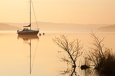 Sailing boats at dawn on Lake Windermere at Waterhead, Ambleside in the Lake District National Park, Cumbria, England, United Kingdom, Europe