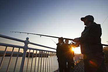 Fisherman sea fishing at Wearmouth in Sunderland, Tyne and Wear, England, United Kingdom, Europe