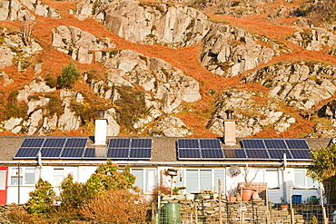 Solar panels on Council houses in Chapel Stile in the Langdale Valley, Lake District, Cumbria, England, United Kingdom, Europe