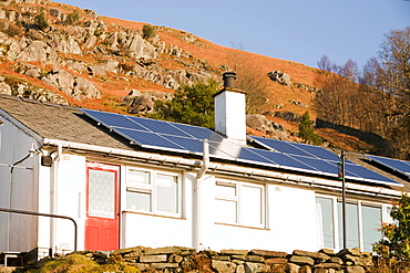 Solar panels on Council houses in Chapel Stile in the Langdale Valley, Lake District, Cumbria, England, United Kingdom, Europe