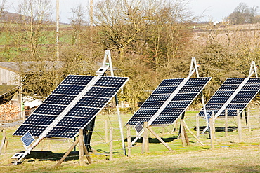 Solar panels and wind turbines on a farm near Woodhouse Eaves in Leicestershire, England, United Kingdom, Europe