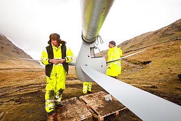 Three wind turbines being constructed behind the Kirkstone Pass Inn on Kirkstone Pass in the Lake District, Cumbria, England, United Kingdom, Europe