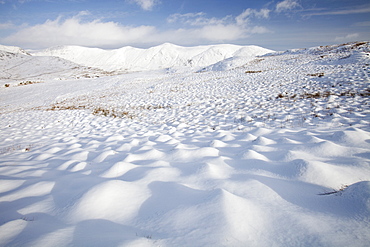 Snowy hummocks on Wansfell above Ambleside, looking towards the Kentmere Fells, Lake District, Cumbria, England, United Kingdom, Europe