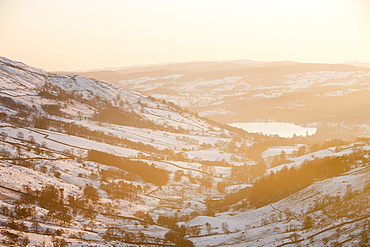 Looking down towards Ambleside and Lake Windermere from Kirkstone Pass at sunset, Lake District, Cumbria, England, United Kingdom, Europe