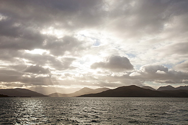 Sunlight over the mountains of Skye from Raasay, Scotland, United Kingdom, Europe