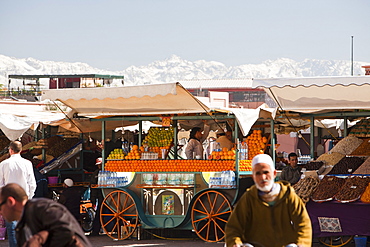 Orange juice stall with the Atlas mountains covered in snow behind, Marrakech, Morocco, North Africa, Africa