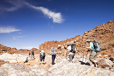 Trekkers in the Jebel Sirwa region of the Anti Atlas mountains, Morocco, North Africa, Africa.