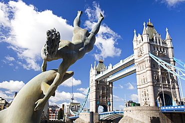 Dolphin sculpture and Tower Bridge, London, England, United Kingdom, Europe