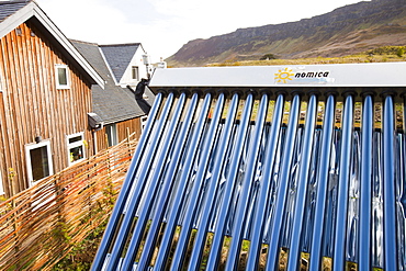 Solar thermal panels on a house on the Isle of Eigg which is 98% powered by renewable energy, west coast, Scotland, United Kingdom, Europe