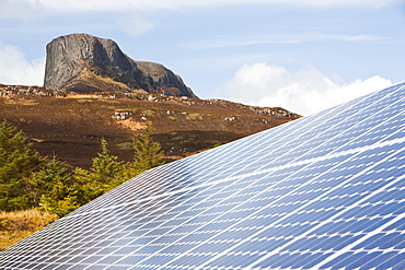 Solar panels in front of An Sgurr on the Isle of Eigg, Scotland, United Kingdom, Europe