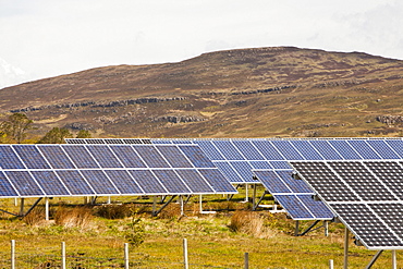 Solar panels in front of An Sgurr on the Isle of Eigg, Scotland, United Kingdom, Europe