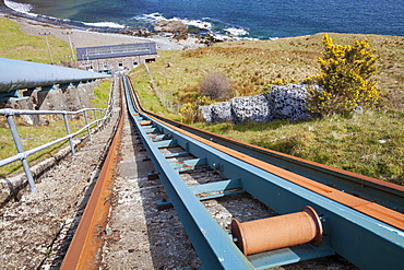 Railway line used to haul equipment up and down to Loch Leathan hydro power station on the Trotternish Peninsula, Isle of Skye Scotland, United Kingdom, Europe