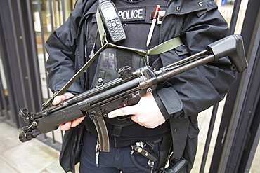 Armed police officer protecting the American Embassy in Grosvenor Square, London, England, United Kingdom, Europe