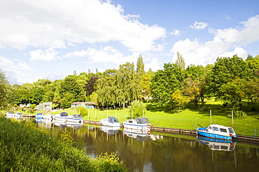 A house with river frontage and a boat mooring on the River Avon at Pershore in Worcestershire, England, United Kingdom, Europe