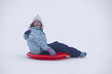 Child playing in the snow in Aviemore, Scotland, United Kingdom, Europe