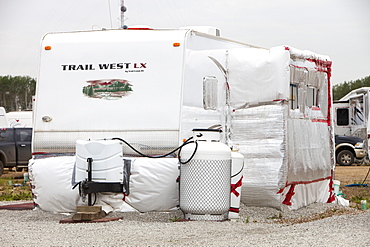 Insulated RV's and trailers where workers from the tar sands industry live north of Fort McMurray, Alberta, Canada, North America