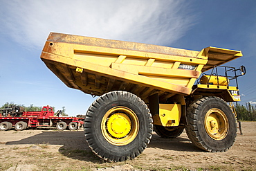 Massive dump trucks by the Syncrude upgrader plant, Alberta, Canada, North America