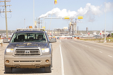 A security guard by the Syncrude upgrader plant, Alberta, Canada, North America