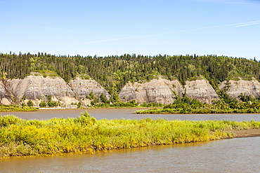 Tar sands deposits exposed in the side of the Athabasca River, Fort McMurray, Alberta, Canada, North America