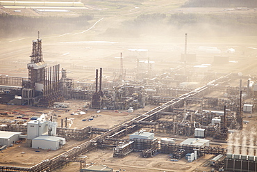 Hideous air pollution from the Syncrude Tar sands upgrader plant north of Fort McMurray, Alberta, Canada, North America