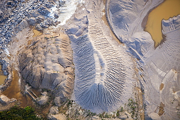 Soil overburden being removed to get at the tar sands below, in a mine north of Fort McMurray, Alberta, Canada, North America