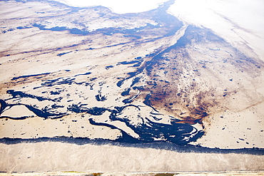 The tailings pond at the Syncrude mine north of Fort McMurray, Alberta, Canada, North America