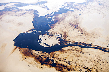 The tailings pond at the Syncrude mine north of Fort McMurray, Alberta, Canada, North America