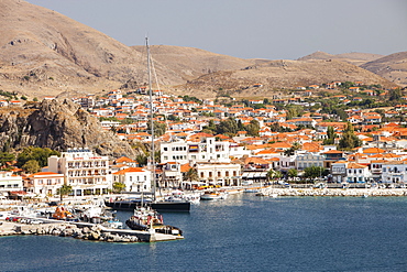 A sailing boat with a 200 feet tall mast in Myrina harbour on Lemnos, Greek Islands, Greece, Europe