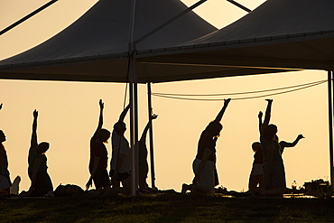 A stretch and relax class at sunset at a holiday complex in Myrina on Lemnos, Greek Islands, Greece, Europe