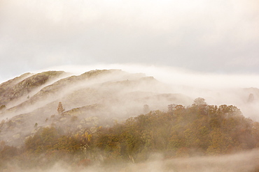 Mist over Todd Crag above Ambleside in the Lake District National Park, Cumbria, England, United Kingdom, Europe