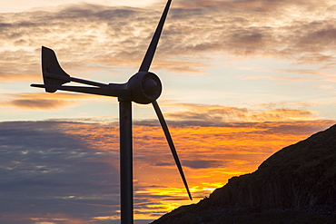 A wind turbine on Kirkstone Pass at sunset, Lake District, Cumbria, England, United Kingdom, Europe