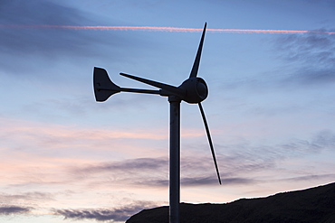 A wind turbine on Kirkstone Pass at sunset, Lake District, Cumbria, England, United Kingdom, Europe