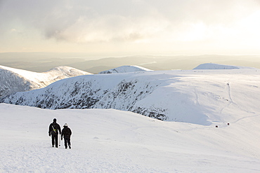 Walkers on Helvellyn in the snow, Lake District National Park, Cumbria, England, United Kingdom, Europe