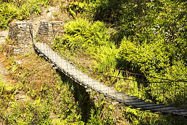 A suspension bridge crossing on the Annapurna Base Camp trek, Himalayas, Nepal, Asia