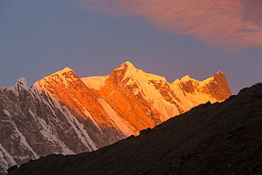 Alpenglow at sunrise on Annapurna Fang, Nepalese Himalayas, Nepal, Asia