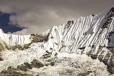 A rapidly retreating glacier on the side of the 6428 metre peak of Gandharwa Chuli in the Annapurna Sanctuary, Nepalese Himalayas, Nepal, Asia