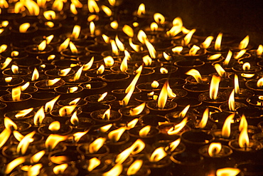 Hindu prayer candles in a shrine in Kathmandu, Nepal, Asia