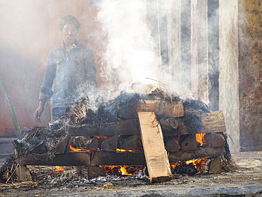 A cremation at the Pashupatinath Temple, a Hindu temple of Lord Shiva on the banks of the Bagmati River, UNESCO World Heritage Site, Kathmandu, Nepal, Asia