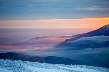 Red Screes above Ambleside with mist from a temperature inversion, looking towards Coniston Old Man, Lake District National Park, Cumbria, England, United Kingdom, Europe