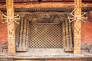 Ancient ornately carved wood window frames on an old building in Kathmandu's Durbar Square, UNESCO World Heritage Site, Kathmandu, Nepal, Asia