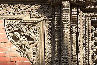 Ancient ornately carved wood window frames on an old building in Kathmandu's Durbar Square, UNESCO World Heritage Site, Kathmandu, Nepal, Asia