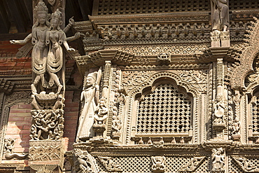 Ancient ornately carved wood window frames on an old building in Kathmandu's Durbar Square, UNESCO World Heritage Site, Kathmandu, Nepal, Asia