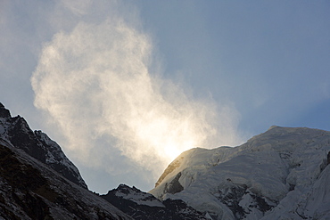 Annapurna South with high winds pushing spindrift off the summit, Annapurna Sanctuary, Himalayas, Nepal, Asia