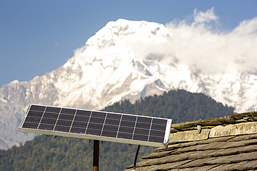 Solar photo voltaic panels on the rooftops of a tea house in the Himalayan foothills, Nepal, Asia